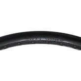 Close up of the 25 x 1 in. (559 mm) Shox Urethane Wheelchair Tire with Herringbone Tread design features solid urethane which provides good suspension.